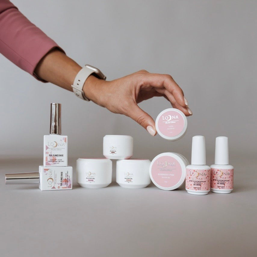 Original Loona product collection held by a manicured hand